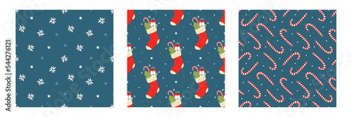 Set, collection of three vector seamless pattern backgrounds with red christmas socks, candy canes and snowflakes.