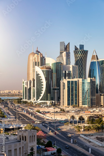 Elevated sunrise view of the urban skyline of Doha, Westbay, Qatar, with the modern skyscrapers and construction sites photo