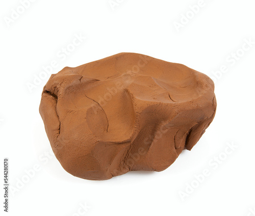 Natural clay piece isolated on white background. Wet clay material for sculpting or modeling. photo
