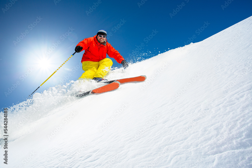 Man skiing in fresh powder snow.