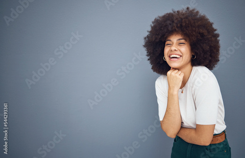 Photos Relax, happy and black woman with natural hair in studio laughing at a funny joke with mockup space