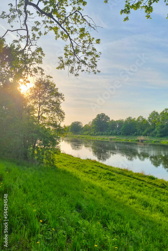 Beautiful sunrise view on the river bank.