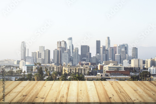 Wooden tabletop with beautiful Los Angeles buildings on background, mock up © Pixels Hunter