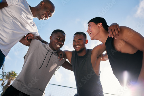 Happy, team building and fitness men on a basketball court planning a strategy, mission and goals in a training game. Sports, mindset and healthy athletes laughing, talking or speaking of a mission