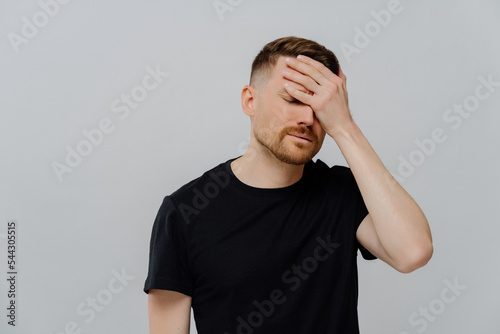 Canvas Print Disappointed man being upset because of doing mistake, feeling of despondency an