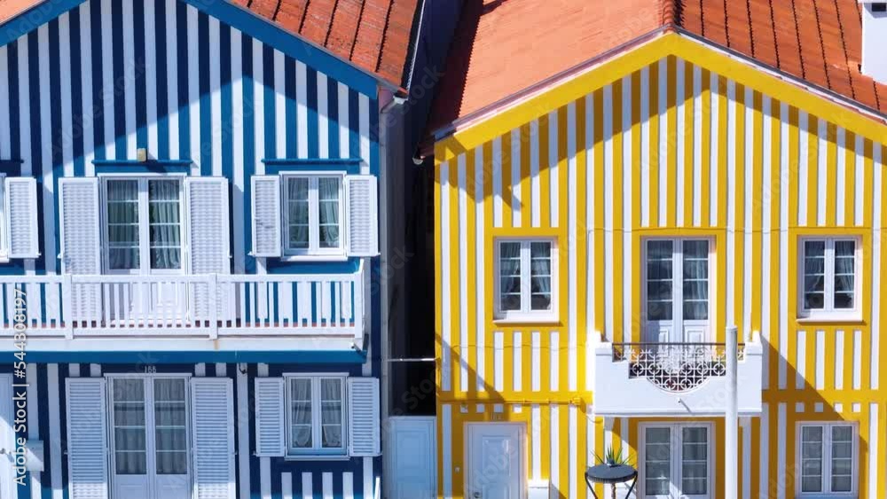 Colored houses on the beach of Costa Nova on the shore of the Ria de Aveiro on the Atlantic coast of Portugal. It belongs to the city of Ilhavo. Aerial view from a drone. Portugal. Europe Colored houses on the beach of Costa Nova on the shore of the Ria de Aveiro on the Atlantic coast of Portugal. It belongs to the city of Ilhavo. Aerial view from a drone. Portugal. Europe