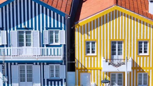 Colored houses on the beach of Costa Nova on the shore of the Ria de Aveiro on the Atlantic coast of Portugal. It belongs to the city of Ilhavo. Aerial view from a drone. Portugal. Europe