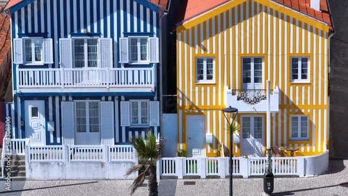 Colored houses on the beach of Costa Nova on the shore of the Ria de Aveiro on the Atlantic coast of Portugal. It belongs to the city of Ilhavo. Aerial view from a drone. Portugal. Europe