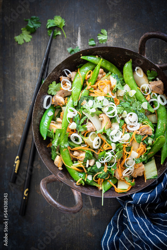Healthy stir fry with snap peas and chicken