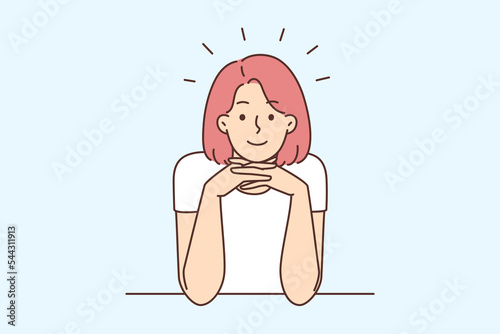 Smiling woman sit at desk talking with someone 