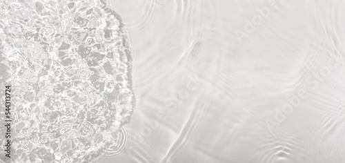 Water panoramic banner background. Water texture, water surface with rings and ripple. Spa concept background. Flat lay, top view, copy space, composition