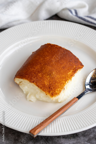 Kazandibi dessert on a dark background. Milky dessert. Traditional Turkish cuisine delicacies. close up photo