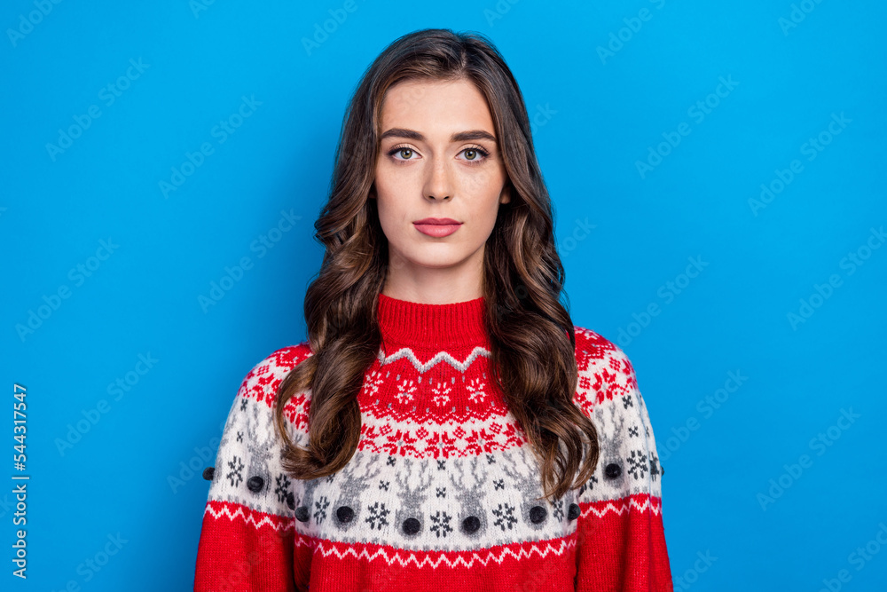 Photo of attractive nice lady calm face dressed red new year warm cozy comfort outfit clothes isolated on blue color background Photo of attractive nice lady calm face dressed red new year warm cozy comfort outfit clothes isolated on blue color background