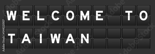 Black color analog flip board with word welcome to taiwan on gray background