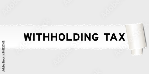 Ripped gray paper background that have word withholding tax under torn part