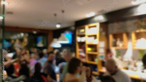 Wallpaper Mural many people mingling, talking and enjoying inside a busy local cocktail bar at the end of the week one day at night, unfocused blocked shot, Ordes, Galicia, Spain Torontodigital.ca