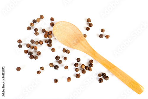 Pepper grains and wooden spoon isolated on white background
