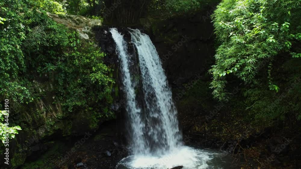 Aerial view towards the Rio do Ouro Waterfall in middle of rainforests of Sao Tome, Africa - 60 fps