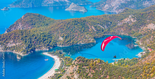 Paraglider flies in the sky -Panoramic view of Oludeniz Beach And Blue Lagoon, Oludeniz beach is best beaches in Turkey - Fethiye, Turkey