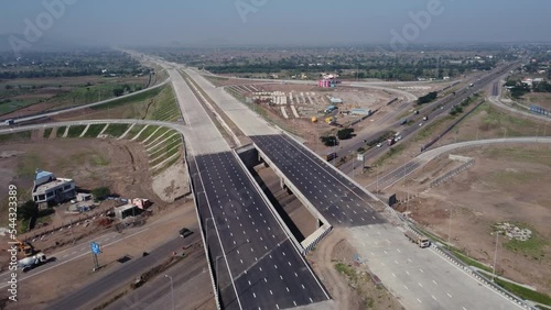 Tracking aerial view of the Interchange of Samruddhi Mahamarg or Nagpur to Mumbai Super Communication Expressway which is an under construction 6 lane highway photo