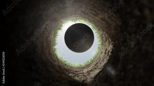 goal achievement success,golf ball falls in the clay hole slow motion,hit the target concept,point of view pov