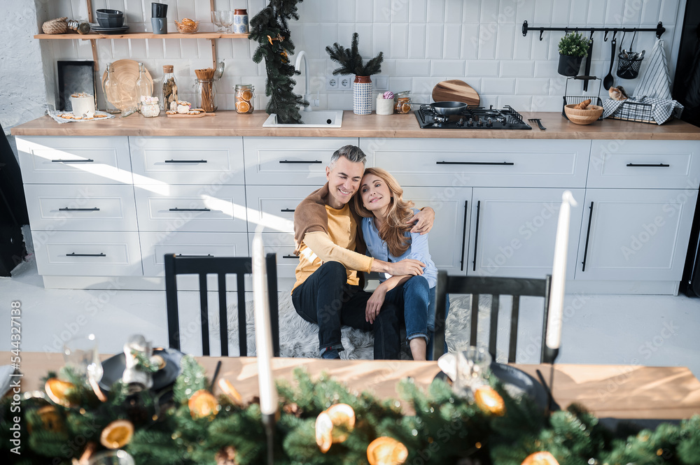 A couple in the kitchen feeling romantic and in love A couple in the kitchen feeling romantic and in love