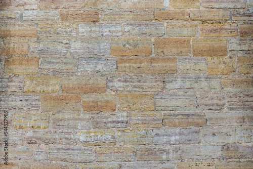 Gray and orange textured brick wall background for stone tiles. Modern interior and exterior design, as well as a background drawing for the designer.