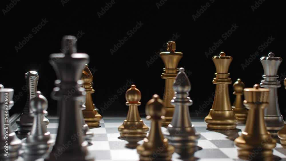 Frustrated chess player strikes and topples chess pieces on board; sore loser Frustrated chess player strikes and topples chess pieces on board; sore loser