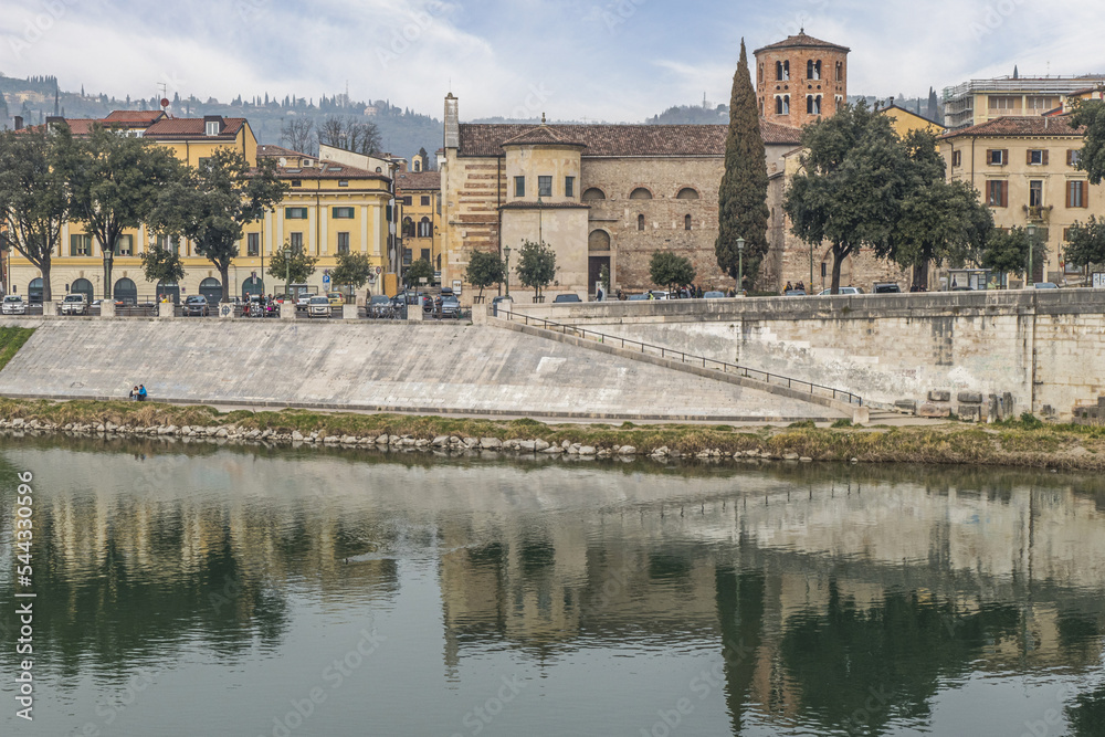 The bank of the Adige in Verona with buildings that are reflected on the water