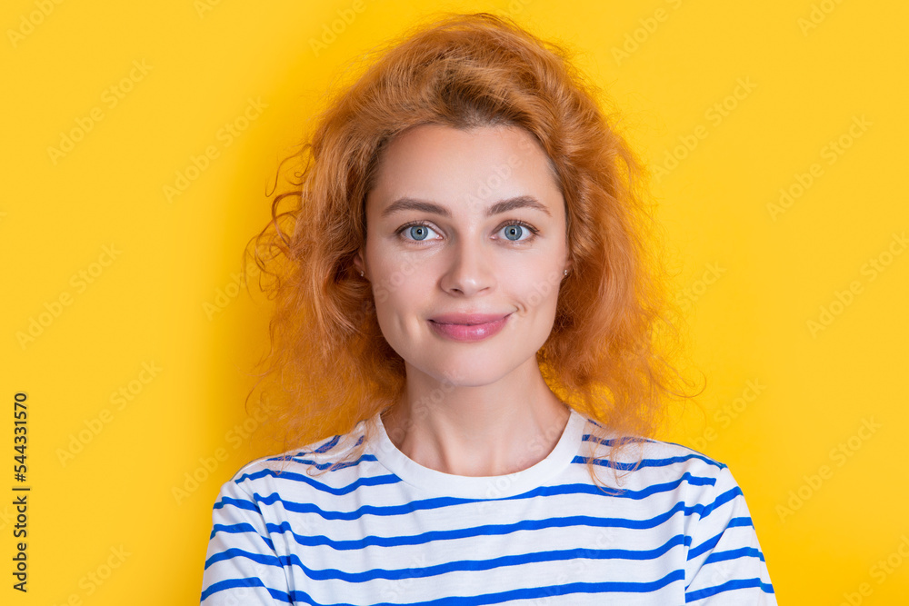 caucasian redhead woman face isolated on yellow background. face of young redhead woman caucasian redhead woman face isolated on yellow background. face of young redhead woman