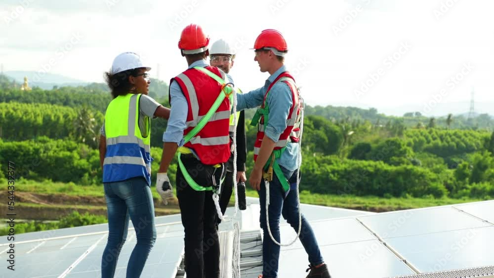 Ethnic diversity worker people, Success teamwork. Group of professional electrician engineering people wearing hardhat safety helmet meeting with solar photovoltaic panels discussion in new project Ethnic diversity worker people, Success teamwork. Group of professional electrician engineering people wearing hardhat safety helmet meeting with solar photovoltaic panels discussion in new project