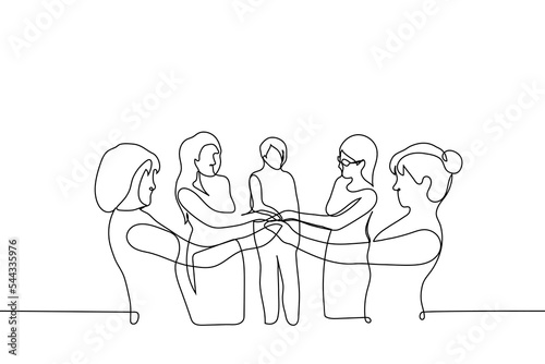 group of women stands with their hands together - one line drawing vector. concept women's union, feminism, women's solidarity,  team, friendship, women's club photo