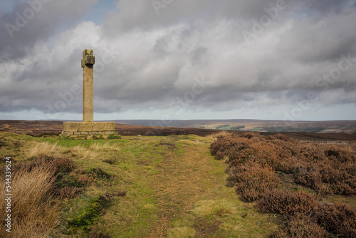 Ana Cross, an ancient stone monument marking the way, stands on top of Spaunton Moor overlooking the Rosedale valley, North York Moors National Park, UK
