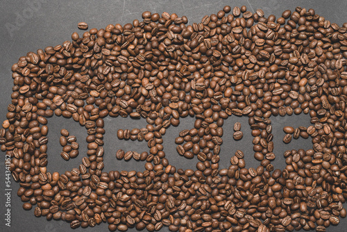 Inscription on decaffeinated coffee beans  top view of coffee.