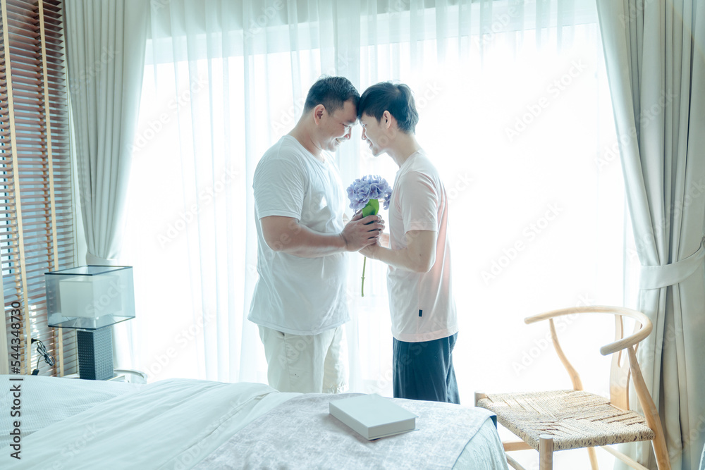 Two gay Asian men in the bedroom consoling support each other on. concept Happy lifestyle and happy house Embrace homosexuality. make a men love scene ,LGBT gay couple relationship lifestyle concept Two gay Asian men in the bedroom consoling support each other on. concept Happy lifestyle and happy house Embrace homosexuality. make a men love scene ,LGBT gay couple relationship lifestyle concept