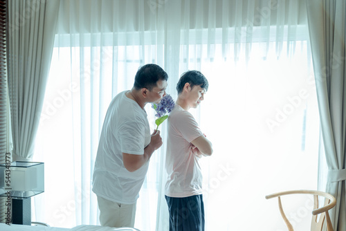Two gay Asian men in the bedroom consoling support each other on. concept Happy lifestyle and happy house Embrace homosexuality. make a men love scene ,LGBT gay couple relationship lifestyle concept