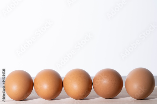 Five eggs standing side by side