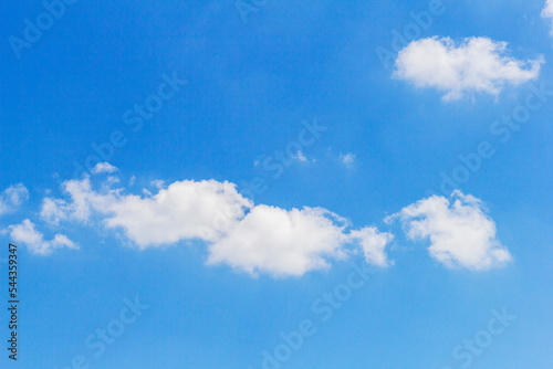 blue sky, with small clouds on a sunny summer day.