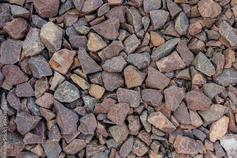 Grey and brown rubble texture. Gravel pebbles stone background. Grey and brown small rocks ground. Grey and brown rubble texture. Gravel pebbles stone background. Grey and brown small rocks ground.