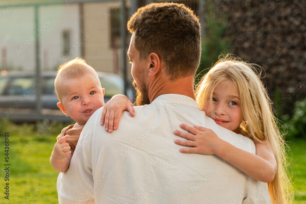 Fototapeta premium Father with happy and smiling children at summer