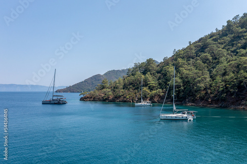 Turquoise sea and aerial view of boats at Ekincik bay. 