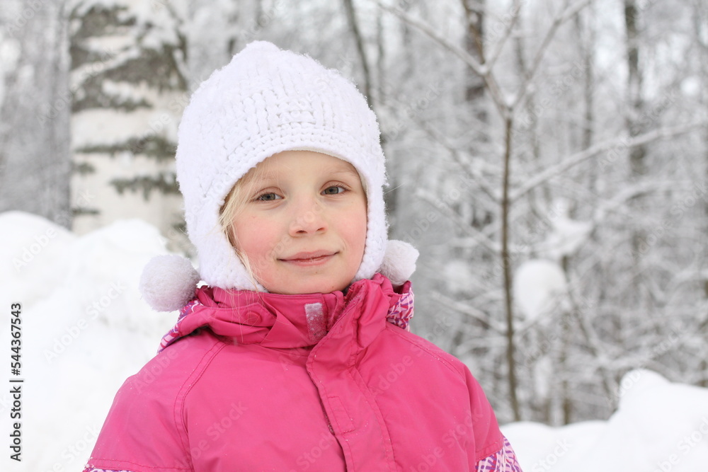 Portrait of cute girl in pink winter coat in the snow park Portrait of cute girl in pink winter coat in the snow park