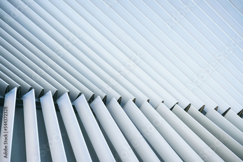 close-up abstract geometry flat pattern of modern architecture exterior facade decoration with metal aluminium material structure background.new futuristic building detail wallpaper concept design.