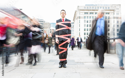 London Professionals, Freedom of Movement. A helpless financial worker restricted by bureaucratic red tape. From a series of related images.