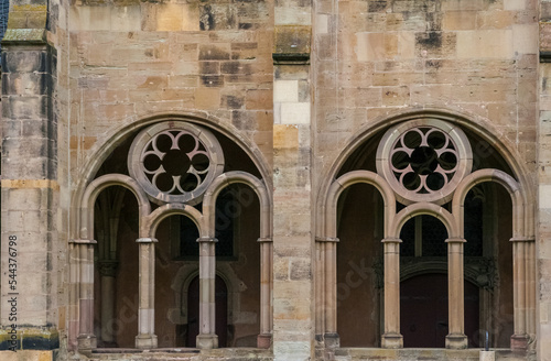 Close-up view of two traced windows of the Gothic cloister corridor built between 1245 and 1270, connecting the famous Trier Cathedral to the Liebfrauenkirche (Church of Our Lady) in Trier, Germany. photo