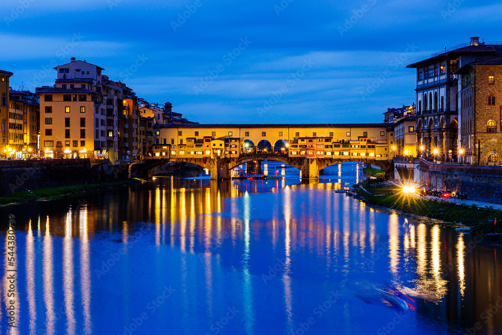 PONTE VECCHIO OF FLORENCE  BY NIGHT - IT WAS THE FIRST AND THE OLDEST BRIDGE IN FLORENCE THAT CROSSES THE ARNO RIVER AT ITS NARROWEST POINT - TUSCANY, ITALY