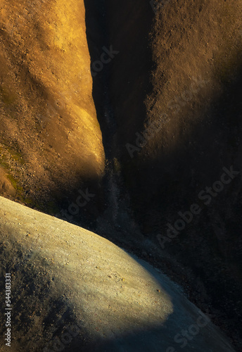 Sunlit smooth stones in nature photo