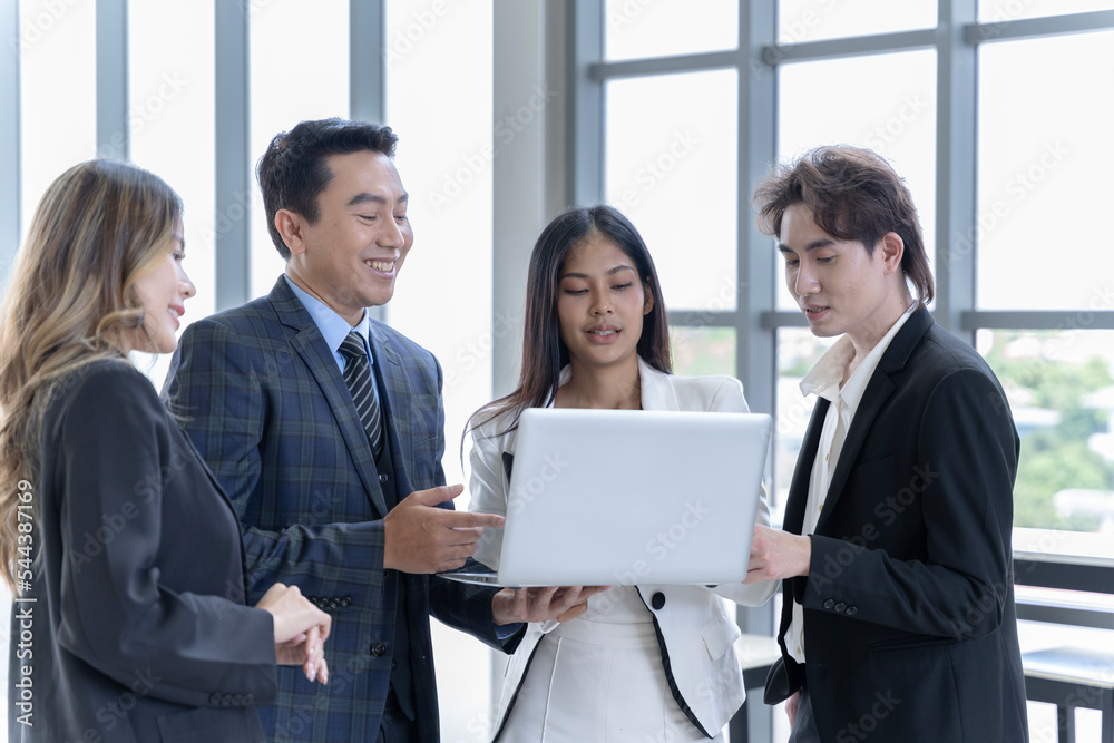 Group of Asian business men and women in Thailand Working together at the company's office for a joint consultation meeting.