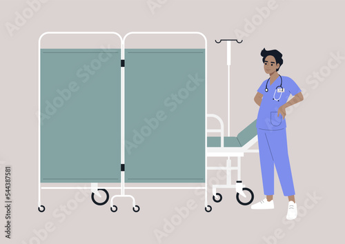 A hospital screen partition on wheels, a medical bed behind a room divider, a young doctor wearing a uniform