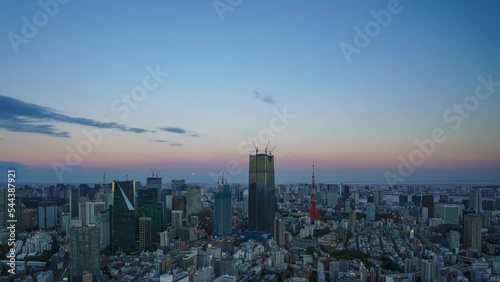 Timelapse video of Lunar eclipse with Tokyo city view from dusk to night. photo